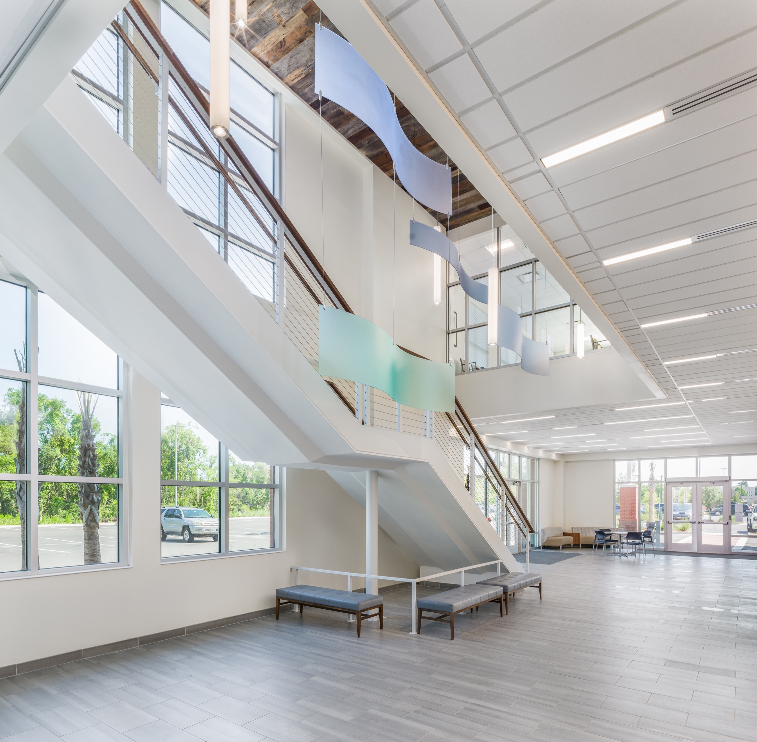Southeastern Spine Institute's modern lobby with architectural staircase and natural lighting